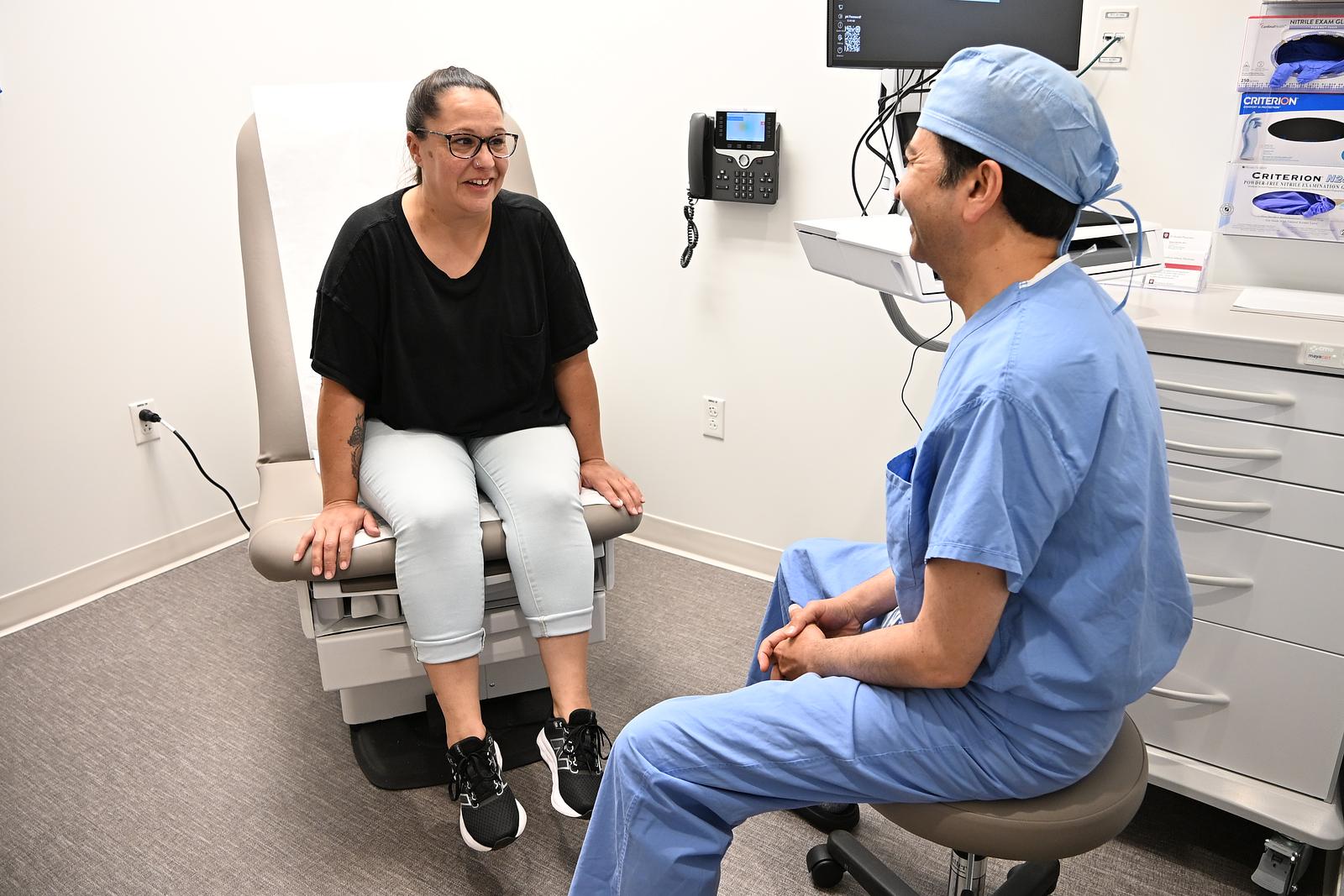 IU Health Bloomington Cardiovascular surgeon Sanjay Tripathi, MD, with first Bloomington robotic cardiac surgery patient Laura May.