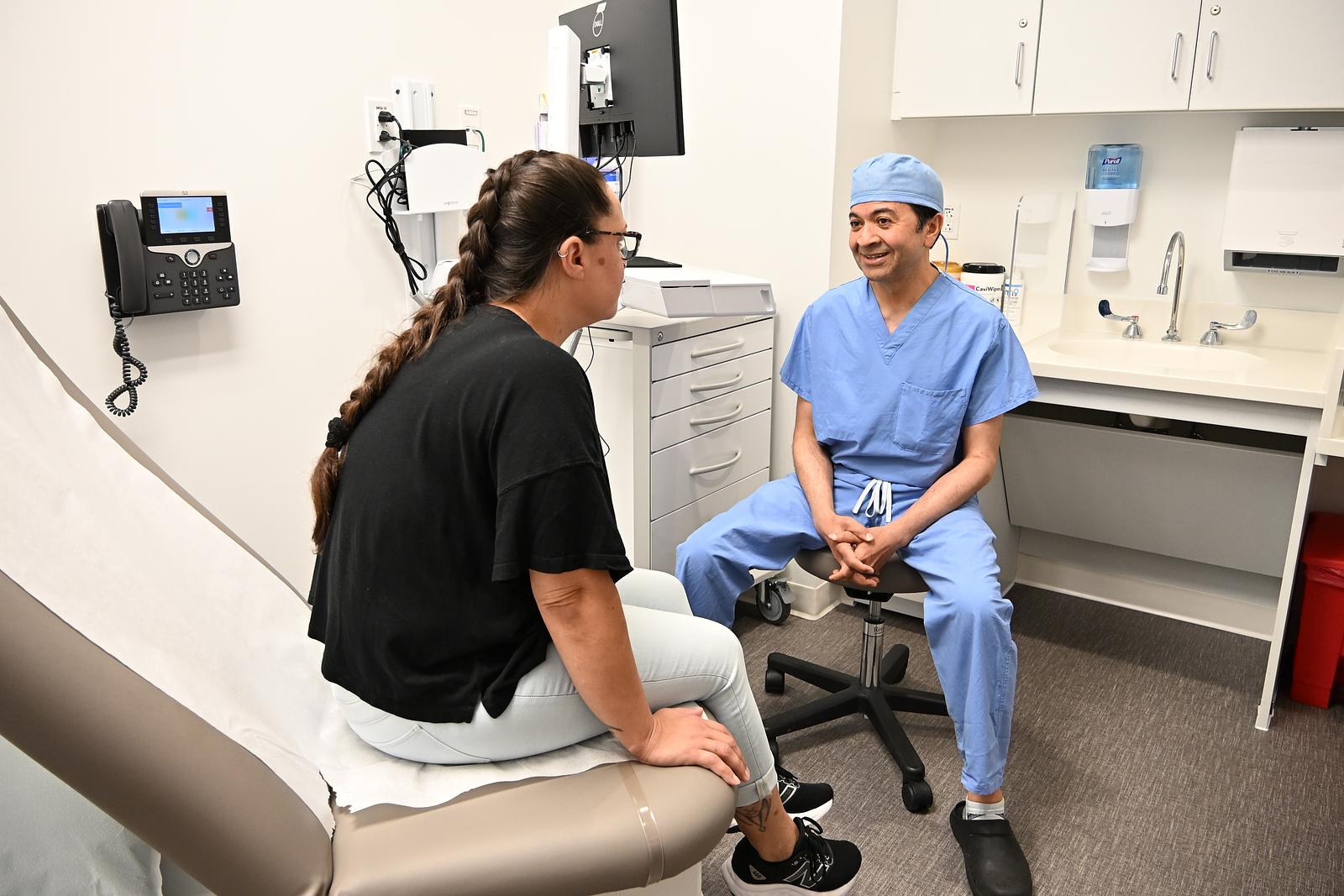 IU Health Bloomington Cardiovascular surgeon Sanjay Tripathi, MD, with first Bloomington robotic cardiac surgery patient Laura May.